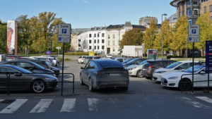 Tesla Says Their Supervised Full Self-Driving Will Automatically Find a Free Spot Even in a Busy Parking Lot & Park Itself